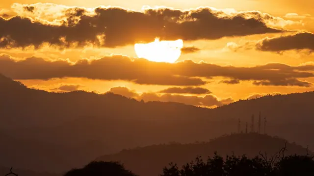 Golden sunset light over layered Kenyan hills