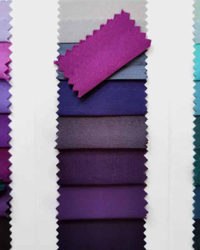 A column of purple and blue fabric swatches