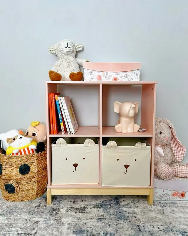 A pastel playroom shelf with toys, books and a basket