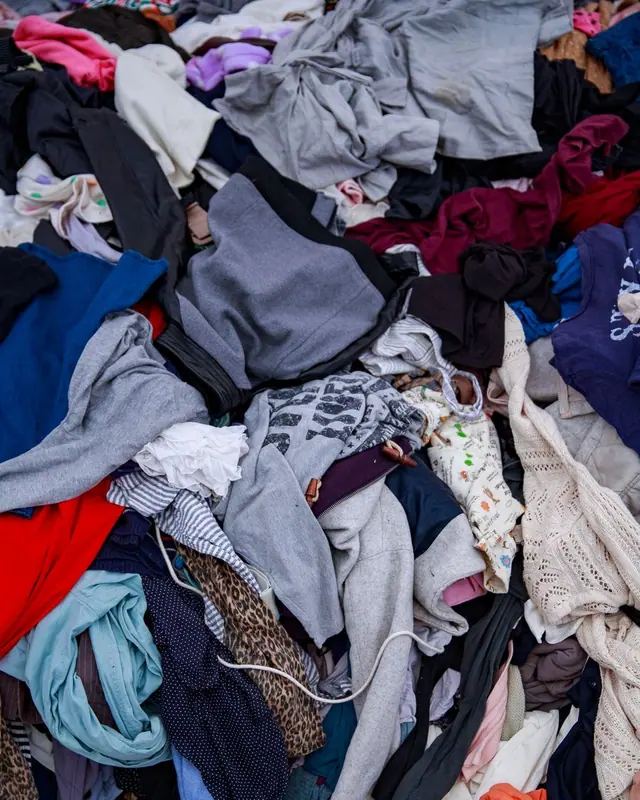 A large pile of mixed clothes ready for reuse